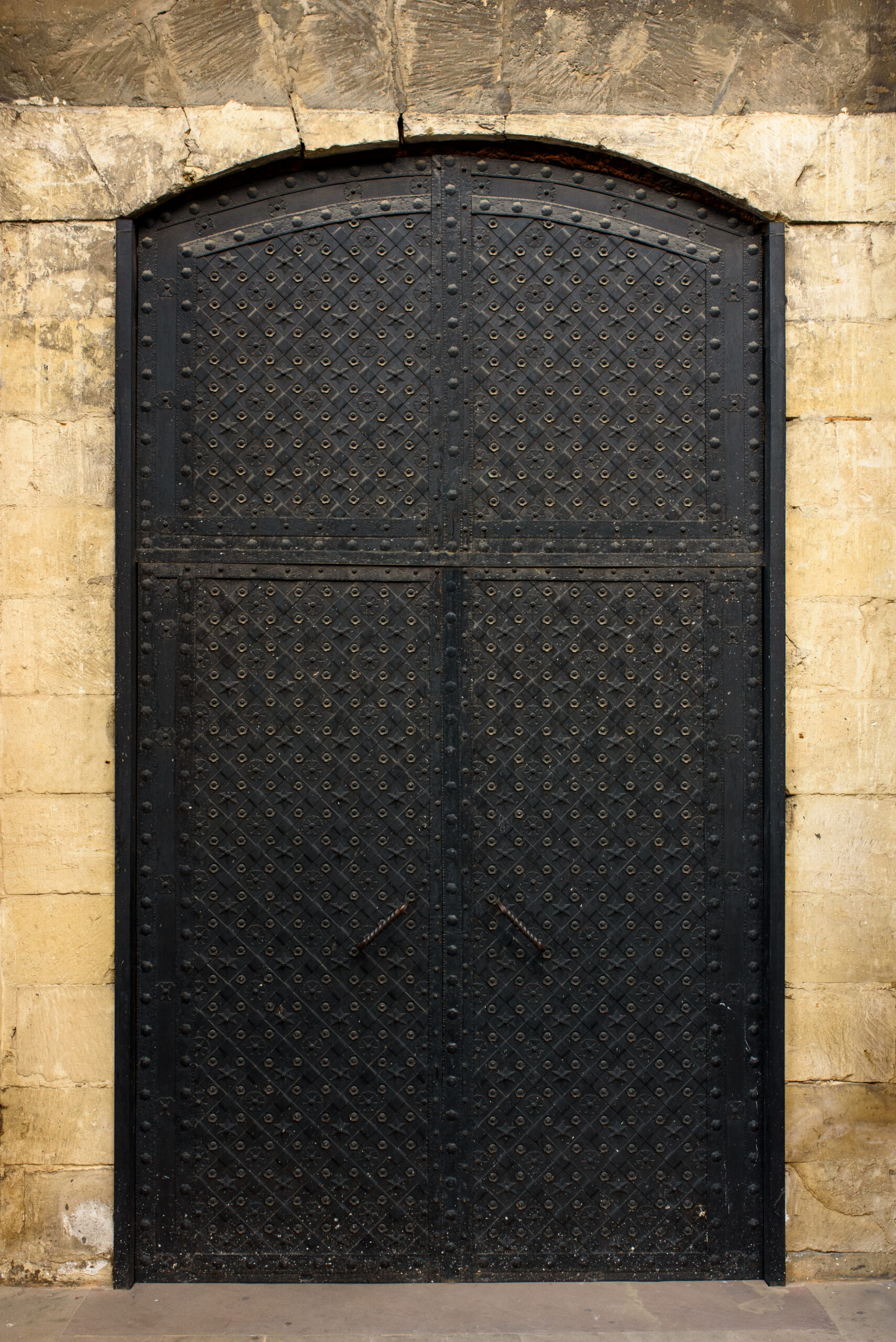 Metal rusted old big gate of ancient castle. Although the gates are old, people still use them